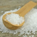 Spoon with salt. Salt is one of several natural cleaners for your home