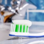 Toothpaste on toothbrush. Natural cleaners to keep at home