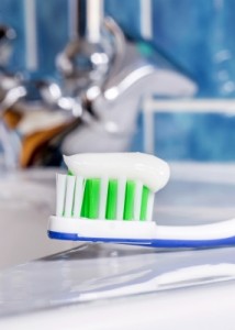 Toothpaste on toothbrush. Natural cleaners to keep at home