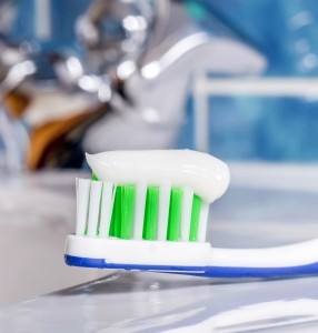 Toothpaste on toothbrush. Natural cleaners to keep at home