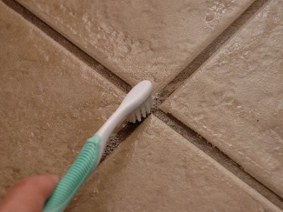 Toothbrush cleaning grout. 3 reasons to choose professional grout cleaning