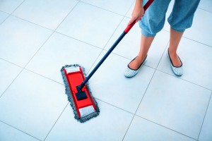 Woman mopping floor. Best way to clean tile floor E&B Carpet