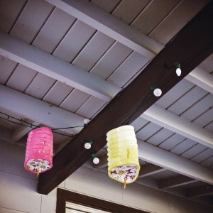 E&B Carpet Chinese Lanterns hanging from rafters pink and yellow