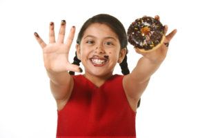 Girl Holding Donut | E&B Carpet Cleaning