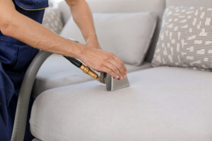 you should have your furniture professionally cleaned, women with cleaner