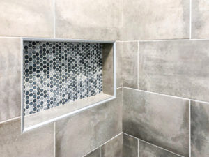 grout in a bathroom tile shower